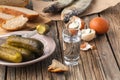 Vodka with traditional Slavonic snacks on table - hering, pickl Royalty Free Stock Photo