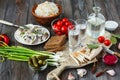 Vodka and traditional snack on wooden background