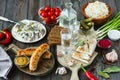 Vodka and traditional snack on wooden background Royalty Free Stock Photo