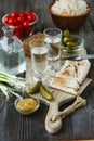 Vodka and traditional snack on wooden background Royalty Free Stock Photo