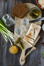 Vodka and traditional snack on wooden background Royalty Free Stock Photo