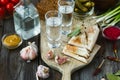 Vodka and traditional snack on wooden background Royalty Free Stock Photo