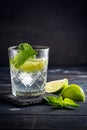 Vodka with water and ice in a glass Cup - alcoholic cocktail with lime Royalty Free Stock Photo