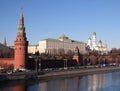 Vodovzvodnaya tower and Grand Kremlin Palace of Moscow Kremlin behind the wall on embankment ot the riverin in bright spring sunny