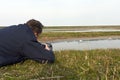 Vogelfotograaf bij het Wagenjot; Bird photographer at the Wagenjot, Texel Royalty Free Stock Photo