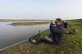 Vogelfotograaf bij het Wagenjot; Bird photographer at the Wagenjot, Texel Royalty Free Stock Photo