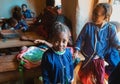 Happy Malagasy school children students in classroom. School attendance is compulsory, but many children do not go to school Royalty Free Stock Photo