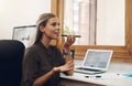 Voice note, chatting or talking of a woman on the phone at work in the office. Businesswoman talking on her speaker Royalty Free Stock Photo