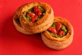 Vol-au-vent with mushroom and chicken, on a red paper
