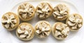 Vol au vent pieces in macro photography, 8 vol au vent pattern on white plate.