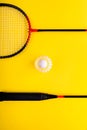 Volant and racket, badminton on yellow background. Concept of summer entertainment. Pop Art Minimalism Royalty Free Stock Photo