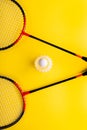 Volant and racket, badminton on yellow background. Concept of summer entertainment. Pop Art Minimalism Royalty Free Stock Photo