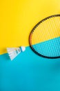 Volant and racket for playing badminton on yellow background. The concept of summer entertainment. Minimalism Pop Art