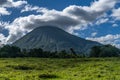 Volcan Arenal dominates the landscape during sunset