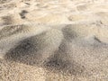 Volcanic beach sand, darker color, almost black. Picture taken on a beach in Lanzarote, Canary Islands, Spain