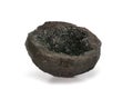 Volcanic bomb from the slopes of Vesuvius volcano, cut-in-half, filled with olivine and other minerals crystals. On white