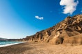 Volcanic cliffs on Vlichada beach, Santorini island, Greece. View of the sea coast at sunny day Royalty Free Stock Photo