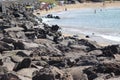 A volcanic coast and sandy beach