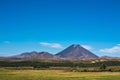 Volcanic cone of Mount Ngauruhoe rising over valley on a fine summer day