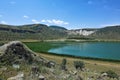 The volcanic Lake Nar is surrounded by mountains.