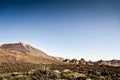 Volcanic landscape of El Teide volcano national park. Dry rock landscape with volcano mountain and deep blue sky. Pico del Teide. Royalty Free Stock Photo