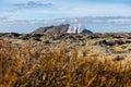 Volcanic landscape of Reykjanes peninsula with lava fields and gas steam of Svartsengi Geothermal Power Plant and Blue Lagoon,