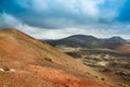 Volcanic landscape in Timanfaya National Park on Lanzarote, Canary Islands, Spain. Dramatic views of volcano craters and Royalty Free Stock Photo