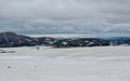 Volcanic landscape with two blue lakes in a middle of lava field covered with snow, Laugavegur hiking trail, Fjallabak Nature