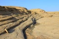 Volcanic layered flat rocks in the Bektau-Ata tract in sunset light Royalty Free Stock Photo