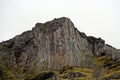 Volcanic mountain with basalt columns wall.