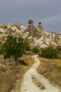 Volcanic rock formations known as fairy chimneys and extreme terrain of Cappadocia, Turkey Royalty Free Stock Photo