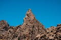 Volcanic rock , layered volcanic rock in desert with mountain landscape and blue sky