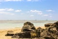 Mauritius Beach, Volcanic Rocks on the beach in the Indian Ocean, Mauritius, golden sand and boats Royalty Free Stock Photo