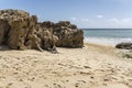 Volcanic rocks on goldenrod sand at Calheta, Porto Santo island Royalty Free Stock Photo