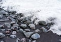 Volcanic Rocks of the Hawaiian Coast in the Raging Waters of the Ocean Royalty Free Stock Photo