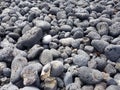 Volcanic rocks rounded by the aleaje of the sea on a beach in Lanzarote, Spain