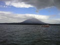 Volcano and boat in Ometepe Island, Nicaragua Royalty Free Stock Photo