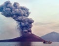 Volcano eruption. Boat near volcano Anak Krakatau, Indonesia Royalty Free Stock Photo