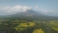 Volcano eruption at green tropical valley aerial. Mayon mount at amazing nobody nature landscape Royalty Free Stock Photo
