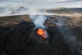 Volcano eruption in Iceland, crater, gas expulsion, and molten lava, aerial view