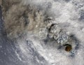 Volcano eruption with smoke and hurricane clouds, satellite view. Collage Royalty Free Stock Photo