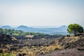 Volcano Etna view with old house and lava stones around