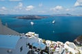 Volcano island with cruisers anchored around at Santorini Royalty Free Stock Photo