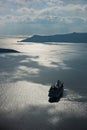 Volcano island with cruisers anchored around at Santorini Royalty Free Stock Photo