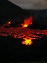 Volcano with lava pouring into the air from a crater