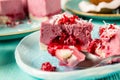 Volcano mini cake with flowing lava from raspberry jam. Close-up, selective focus