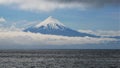 Volcano in Southamerica over the lake and clouds