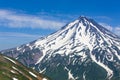 The Volcano Viluchinsky covered with snow at sunny summer day, the Kamchatka Peninsula Royalty Free Stock Photo