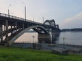 Volga bridge and embankment over Volga river at sunset, Yaroslavl region, Rybinsk city, Russia. Beautiful landscape with water Royalty Free Stock Photo