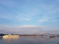 Volga bridge and embankment over Volga river at sunset, Yaroslavl region, Rybinsk city, Russia. Beautiful landscape with water Royalty Free Stock Photo